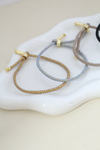 Pulsera de cordón ajustable con dije de ❤️ grabado