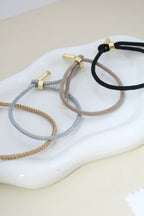 Pulsera de cordón ajustable con dije de ❤️ grabado