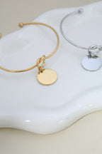 Brazalete de corazón con dije redondo