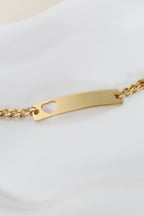 Esclava con detalle de corazón con grabado de mirada